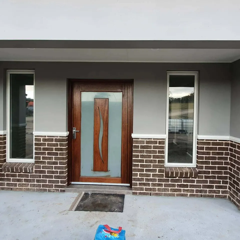 Render, brick and timber entry